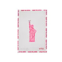 Pink towel with Statue of Liberty design on a white background