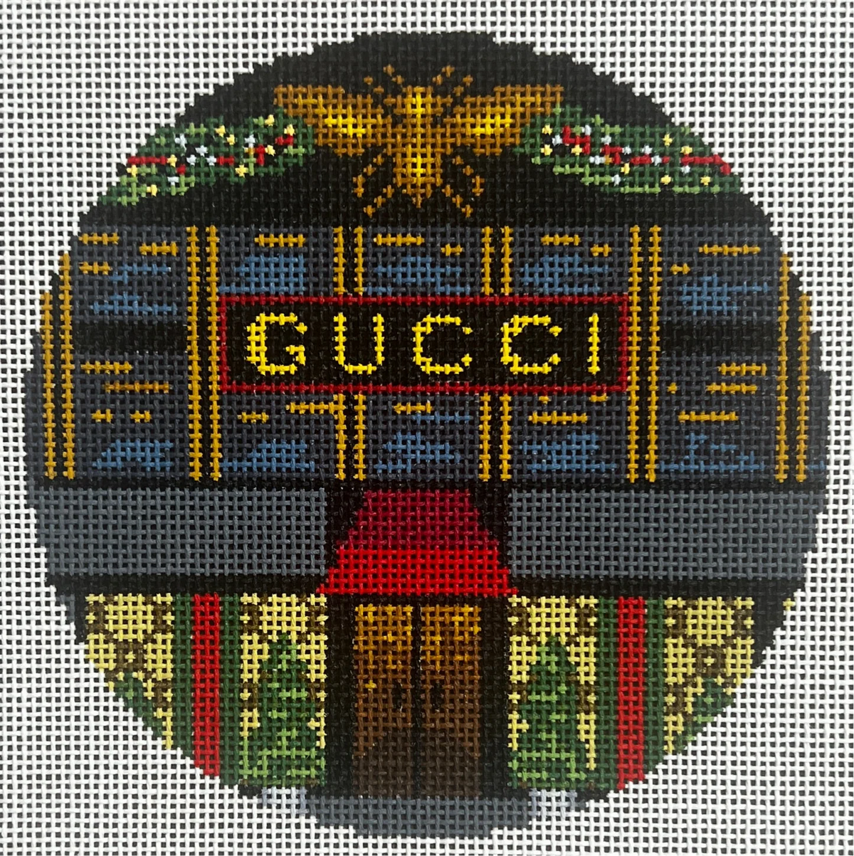 Decorative design with Gucci logo and colorful patterns on a gray background