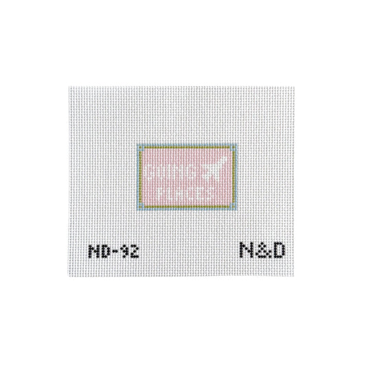 Textured white surface with a small square inset and text 'N&D' at the bottom.