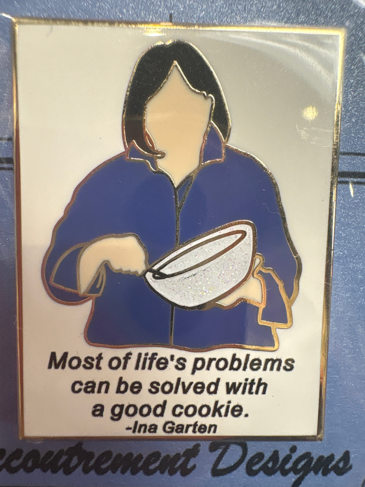Pin with cartoon character and quote on a blue background