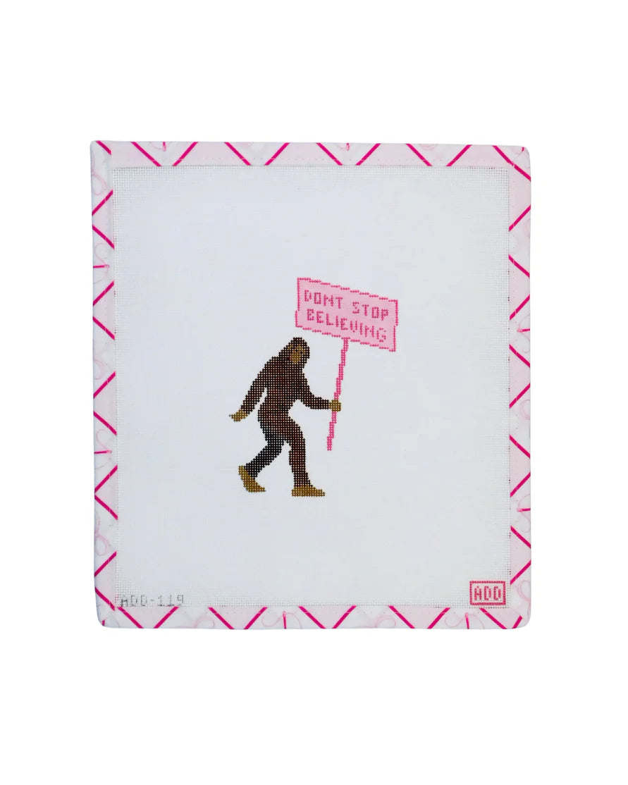 Notebook with a Sasquatch holding a 'Don't Stop Believing' sign on a white background