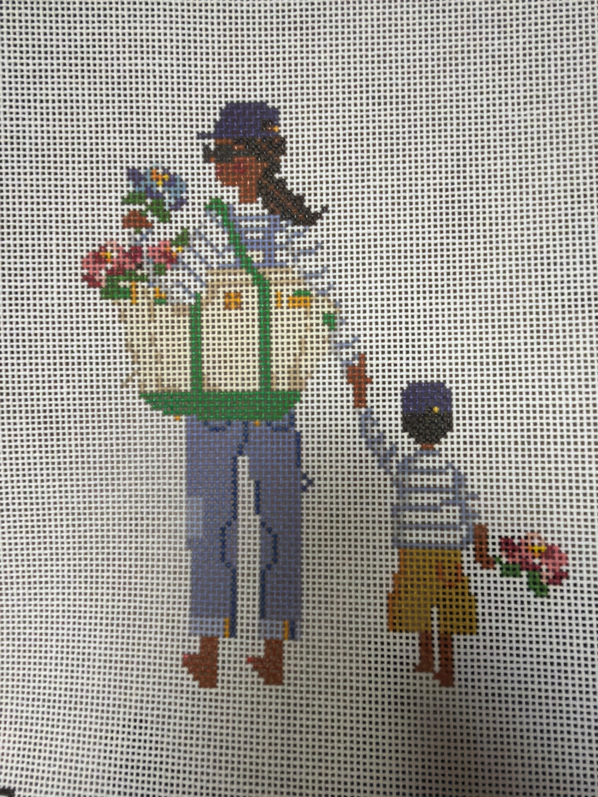 Woman carrying a basket of flowers and holding hands with child