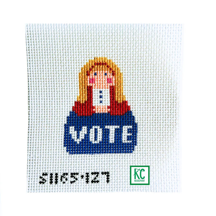 Cross-stitched design of a Mona Lisa with 'VOTE' text on a white background