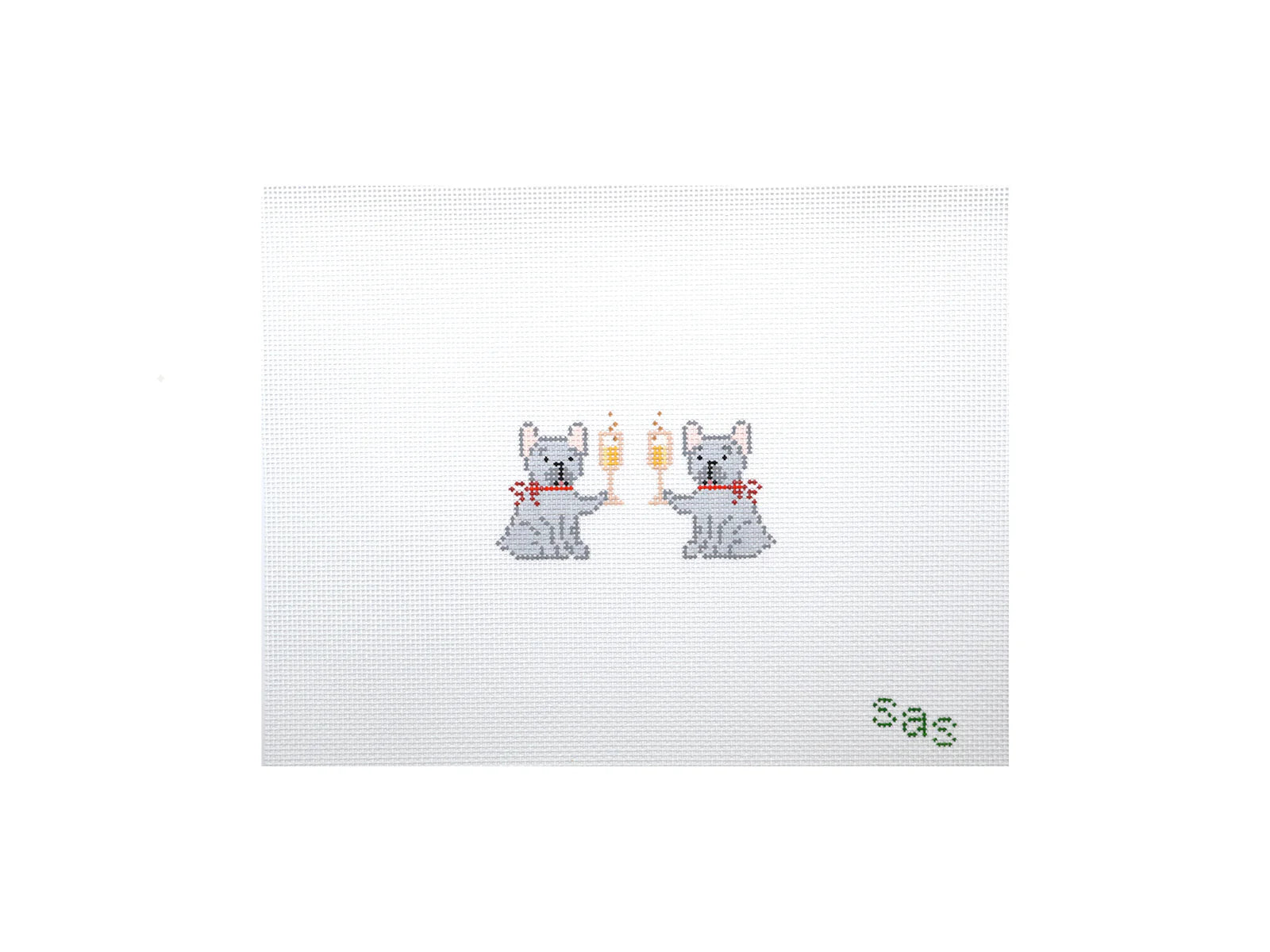 Cross-stitched design of two dogs holding champagne glasses with 'sas' text on a white background
