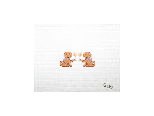 Two dogs holding champagne glasses on a white card with 'sas' text.