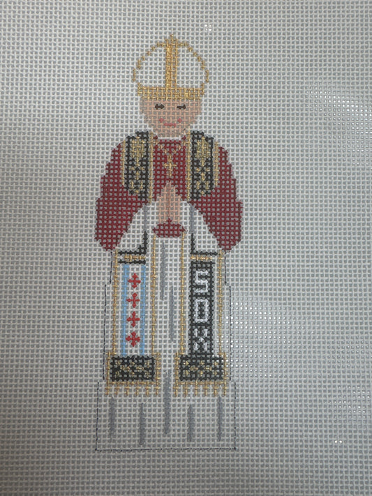 Cross-stitched depiction of a religious figure on fabric
