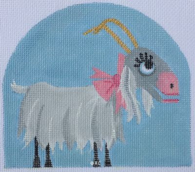 Cross-stitched goat with a pink bow on a blue background