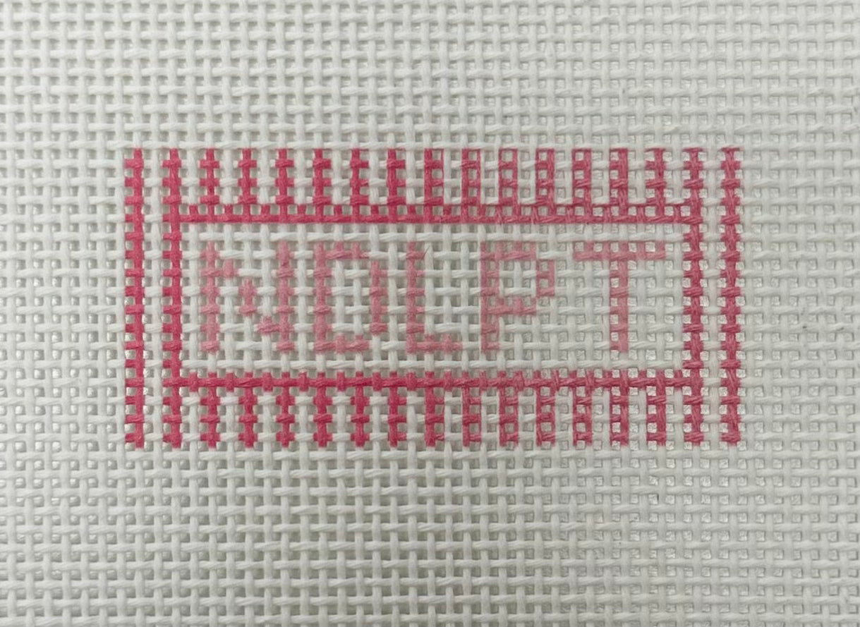 Cross-stitched text 'HOLLY' on a fabric background