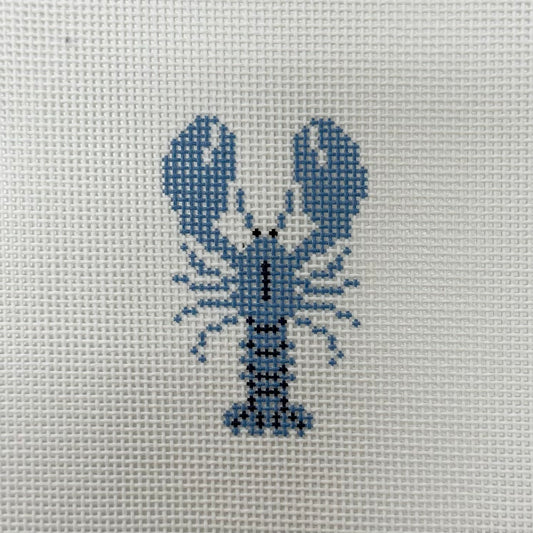 Cross-stitched lobster design on a fabric background