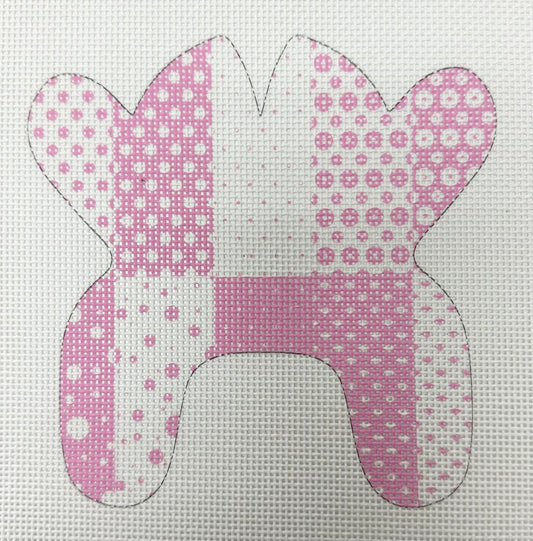 Pink patterned bunny shape on a white background