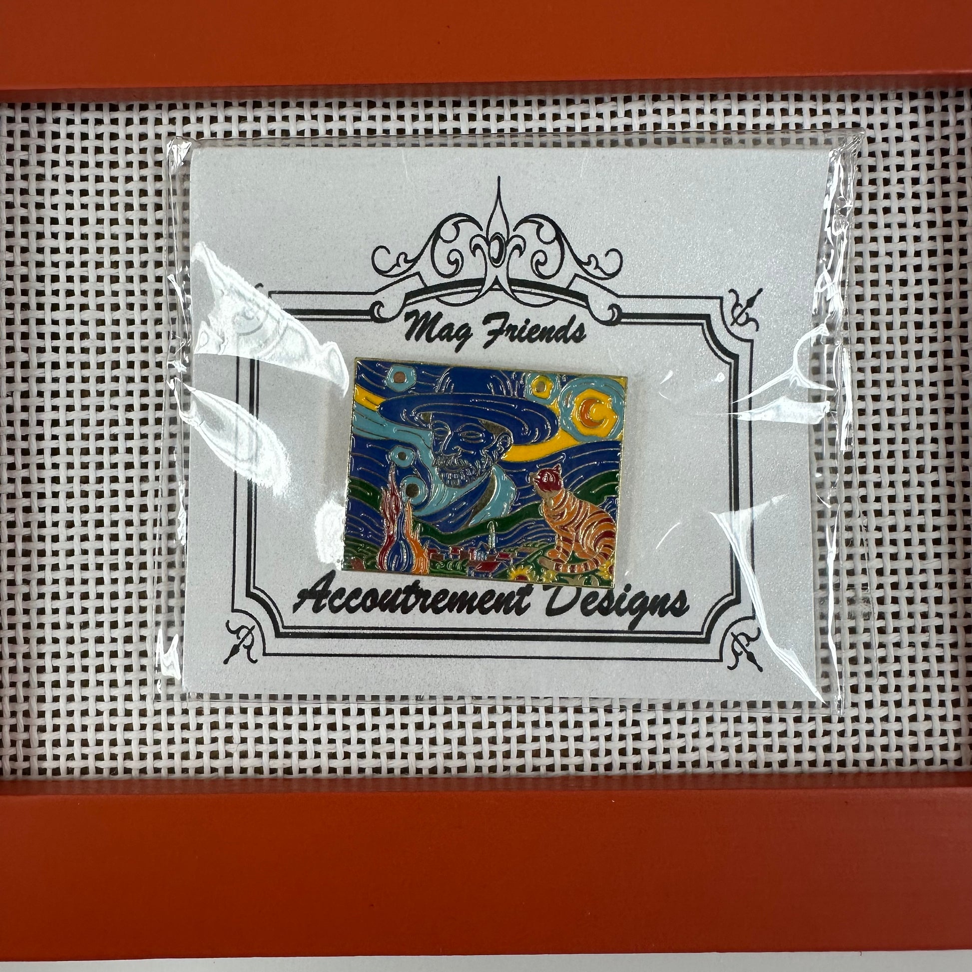 Framed artwork with 'Accoutrement Designs' branding on a grid background