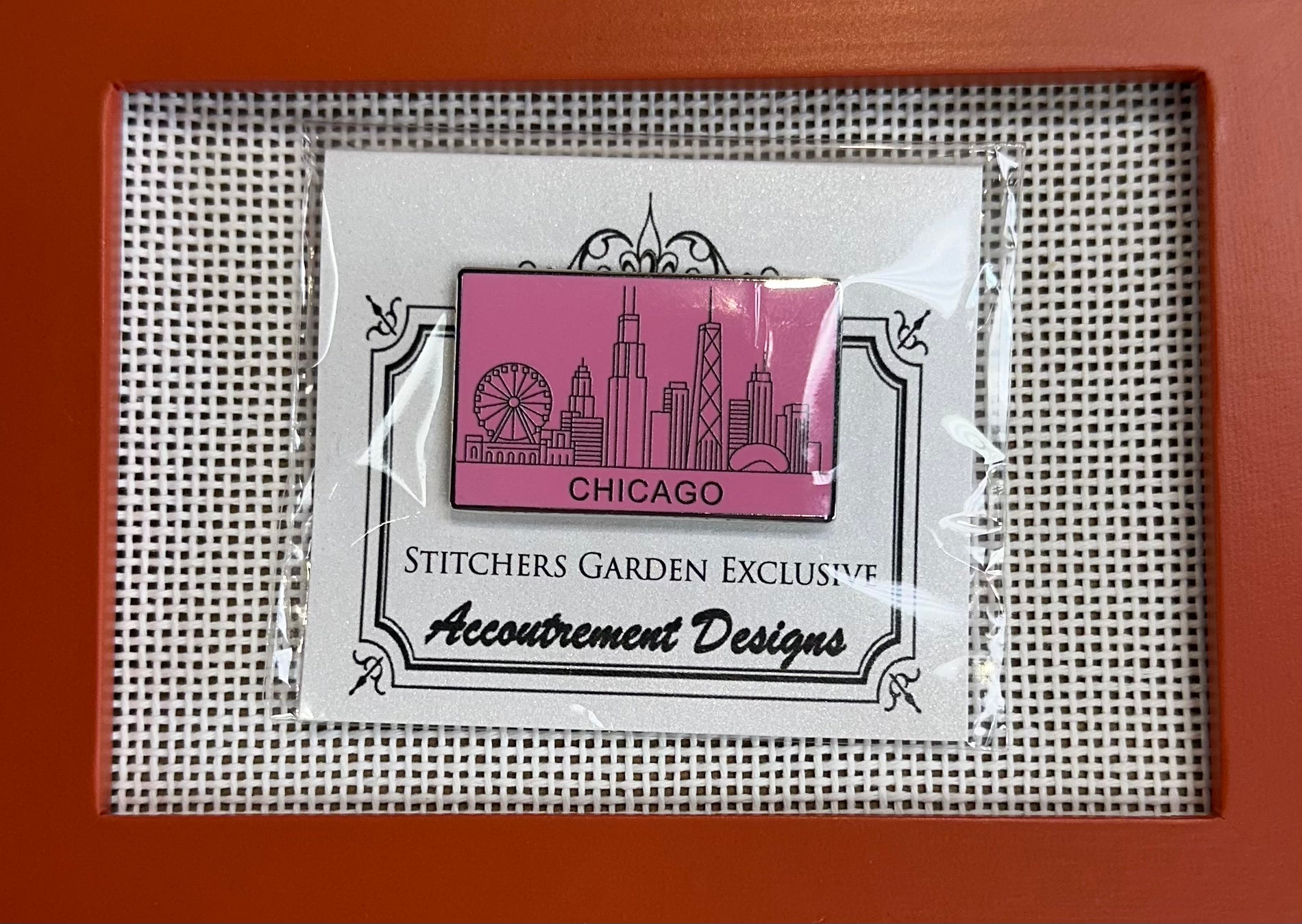 Packaged needlepoint product with 'Chicago' design on a grid background