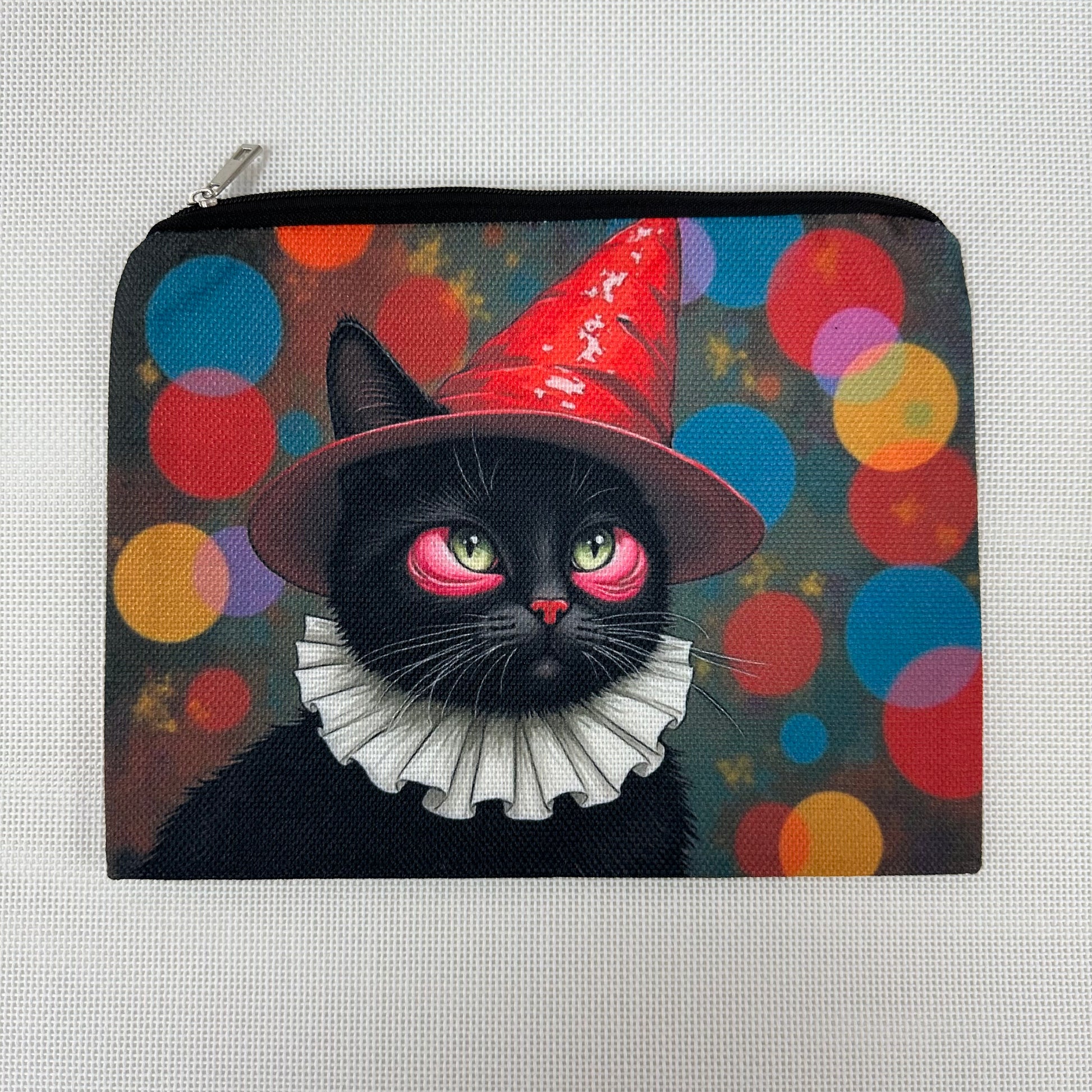 Pouch with a black cat wearing a witch hat on a colorful background