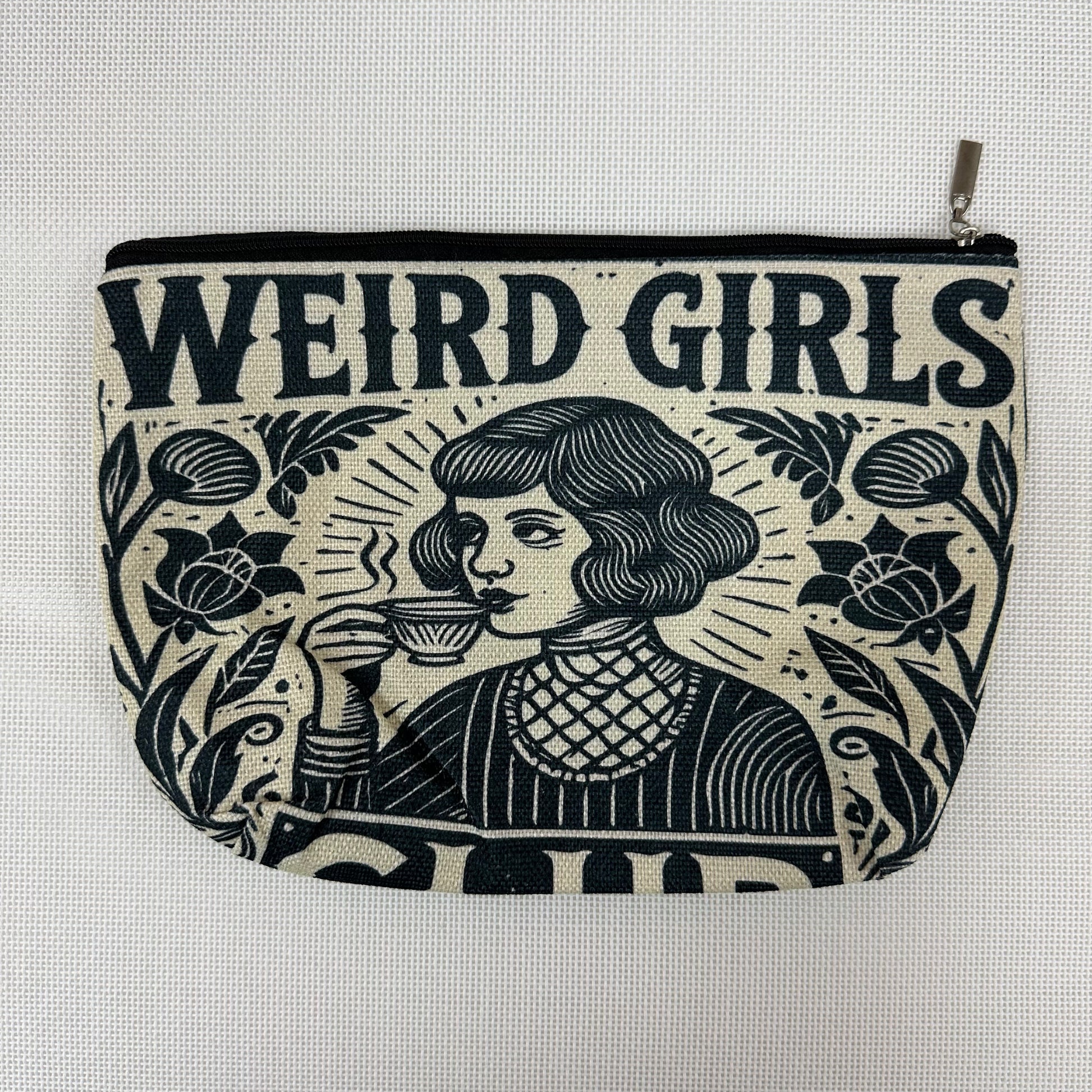 Pouch with 'Weird Girls' text and graphic design on a light gray background