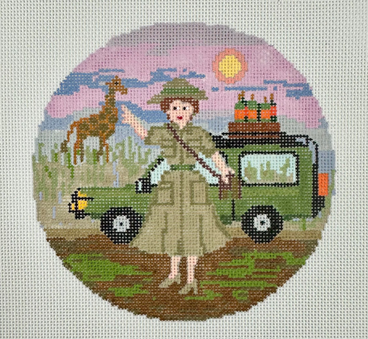 A circular needlepoint canvas featuring a safari-themed design with a woman in a khaki uniform.