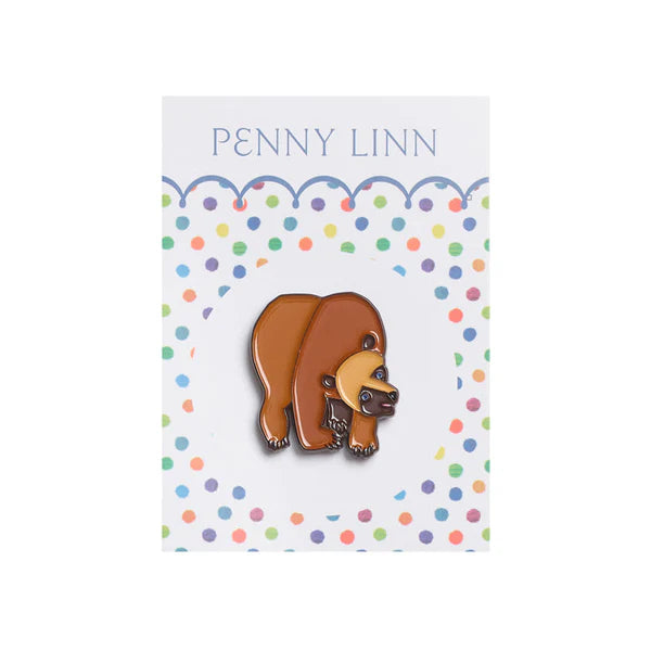 Bear-shaped pin on a card with 'Penny Linn' branding against a white background