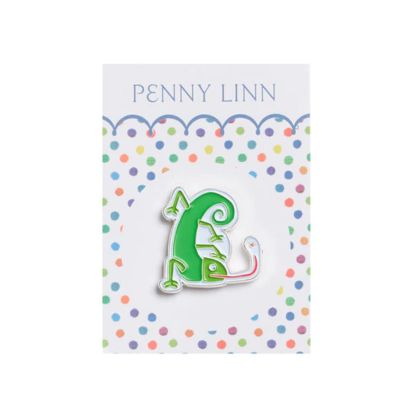 Green chameleon-shaped pin on a card with 'Penny Linn' branding and colorful polka dots.