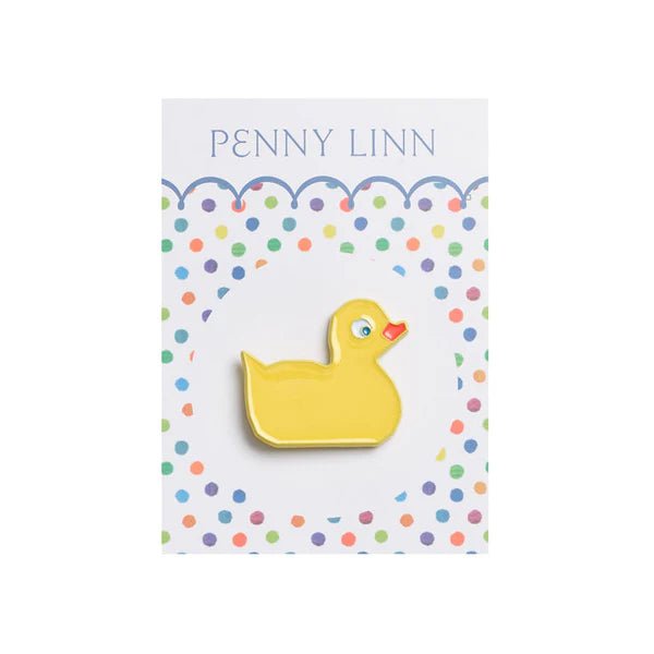 Yellow duck-shaped brooch on a card with 'Penny Linn' branding and colorful polka dots.
