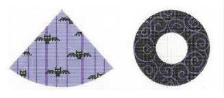 Two decorative items: a triangular purple item with black patterns and a circular black item with white center.