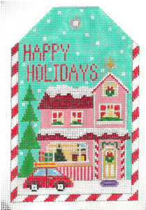 Cross-stitched design of a house with 'Happy Holidays' text on a green background