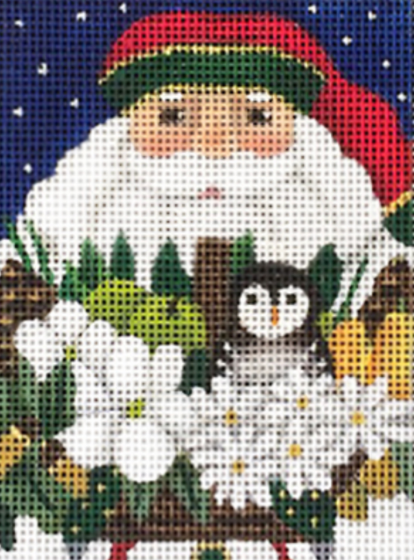 Cross-stitched design of a Santa Claus figure with a cat and flowers on a blue background.