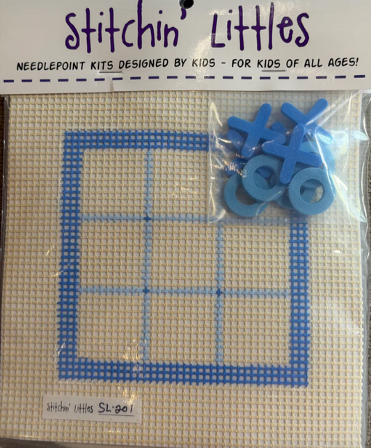 Needlepoint kit with blue plastic mesh and blue plastic cross-stitch markers, branded 'Stitchin' Littles'.