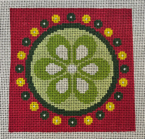 Decorative needlepoint with a green circle and white flowers on a red background