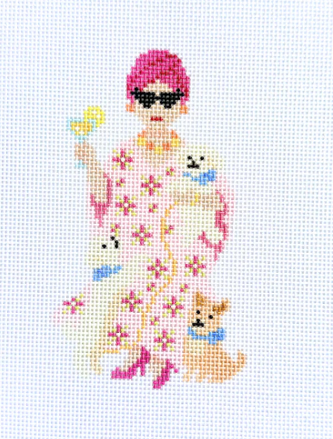 Cross-stitched design of a woman in a floral dress with dogs on a white background