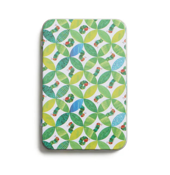Patterned tin with green and blue design on a white background