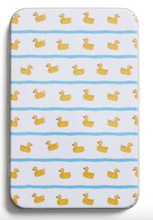 Patterned mat with yellow duck illustrations on a white background