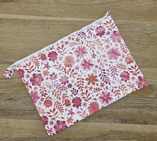Floral-patterned pouch on a wooden surface