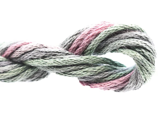 Multicolored yarn skein tied in a knot on a white background
