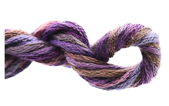 Multicolored yarn skein twisted together on a white background