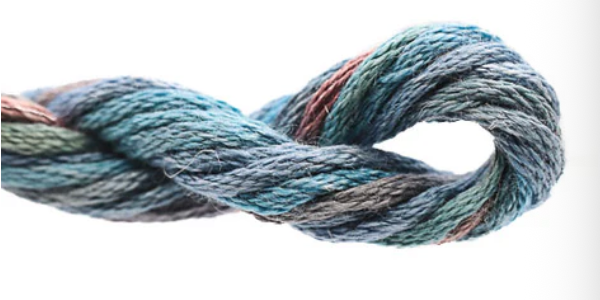 Coiled skein of multicolored yarn on a white background