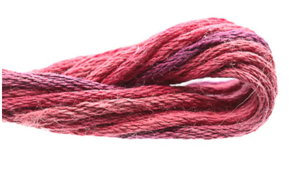 Ball of pink and red yarn on a white background