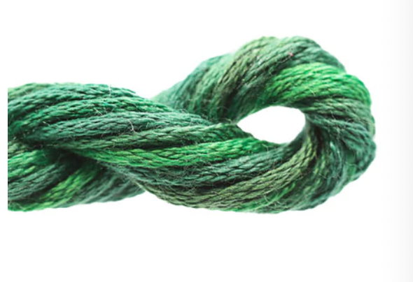 Green rope tied in a knot on a white background