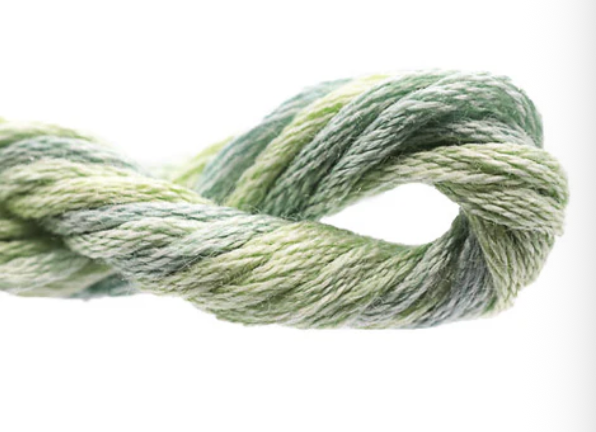 Close-up of green yarn on a white background