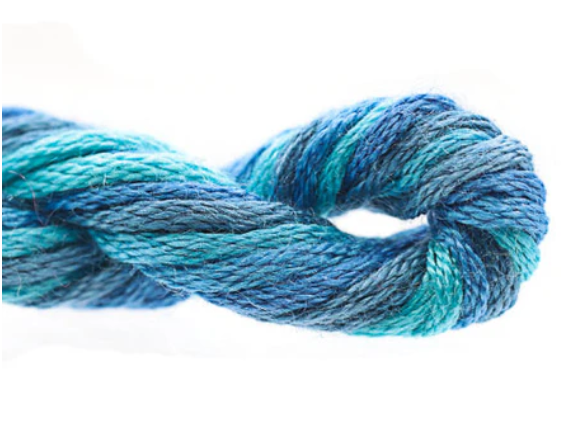 Blue and green skein of yarn on a white background