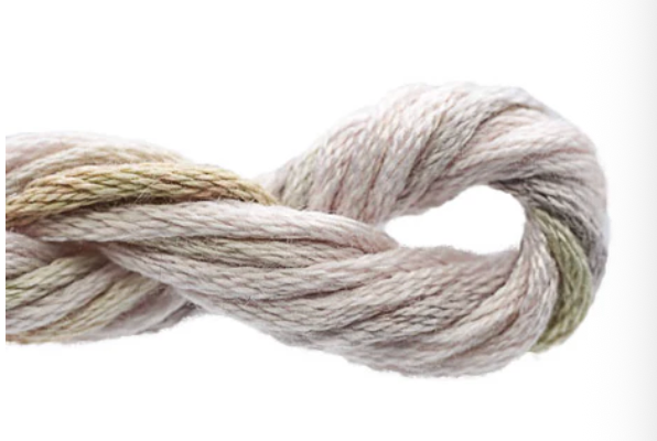 Coiled skein of yarn on a white background