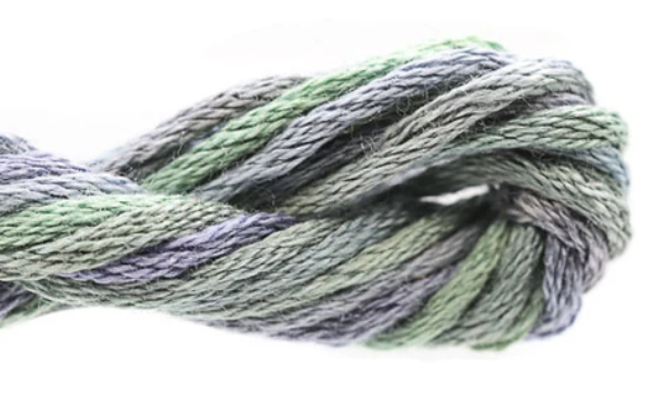 Close-up of green and gray yarn on a white background