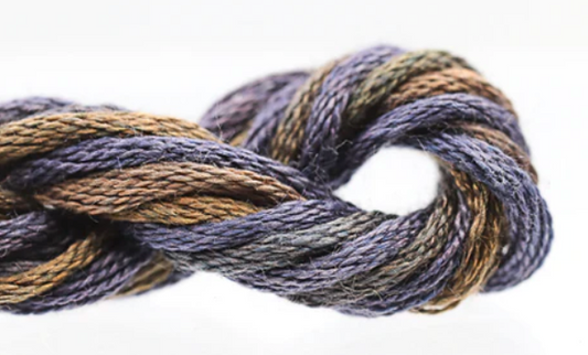 Close-up of a skein of multicolored yarn on a white background