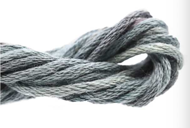 Close-up of a knotted gray rope on a white background
