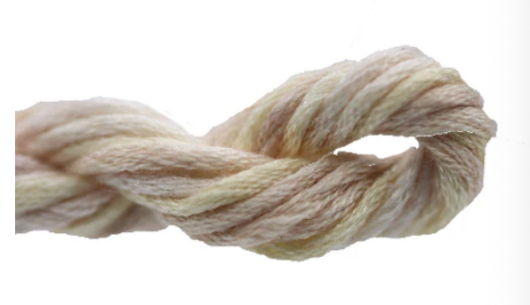 Coiled beige rope on a white background