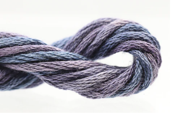 Coiled skein of gray yarn on a white background