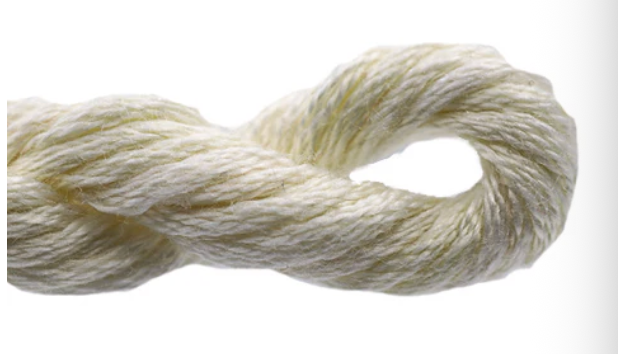 Coiled skein of cream-colored yarn on a white background