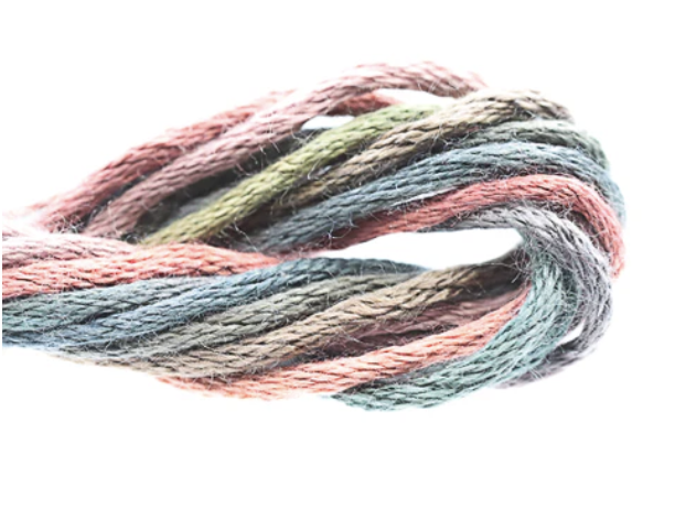 Multicolored skein of yarn on a white background