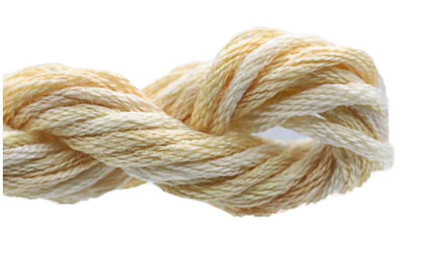 Ball of cream-colored yarn on a white background