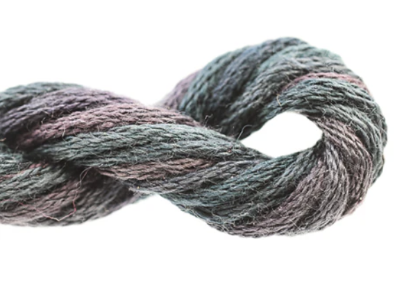 Multicolored skein of yarn on a white background