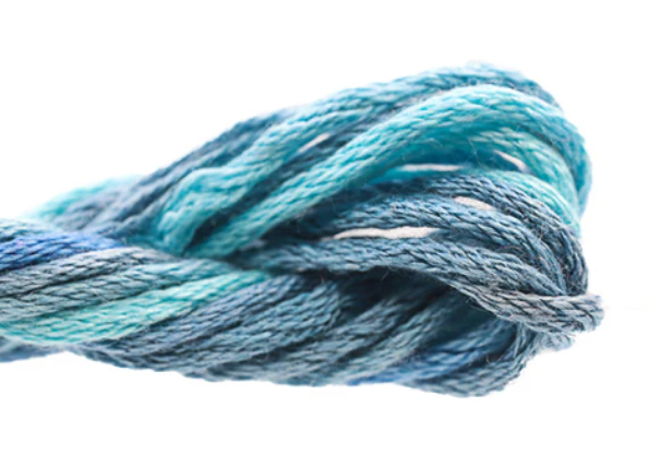 Close-up of blue yarn on a white background