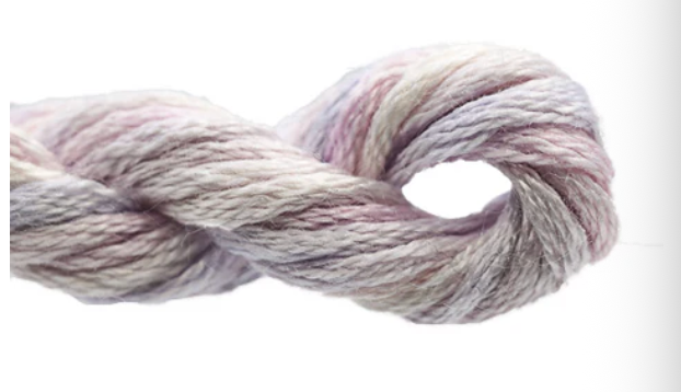 Multicolored skein of yarn on a white background